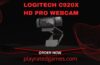 Logitech C920x HD Pro Webcam in black mounted on a monitor, showing its dual microphones and full HD lens.
