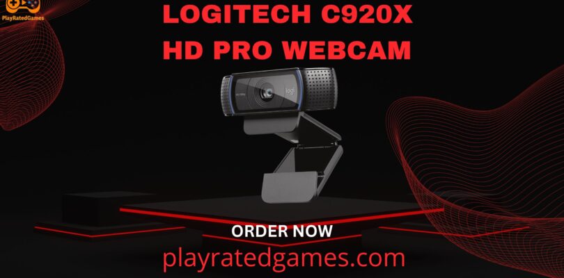 Logitech C920x HD Pro Webcam in black mounted on a monitor, showing its dual microphones and full HD lens.