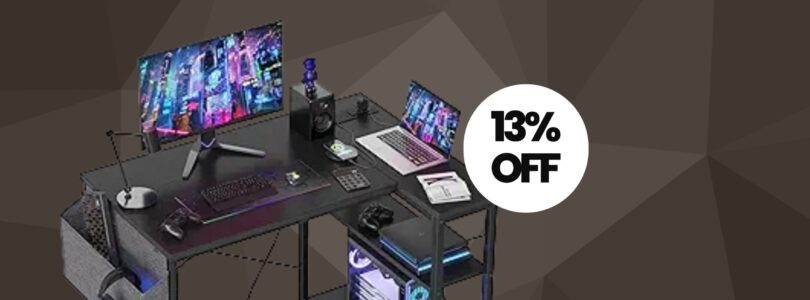 Modern black L-shaped desk with power outlets and shelves, ideal for home offices or gaming setups